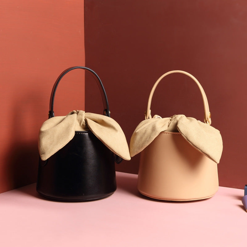 Leather bow bucket bag